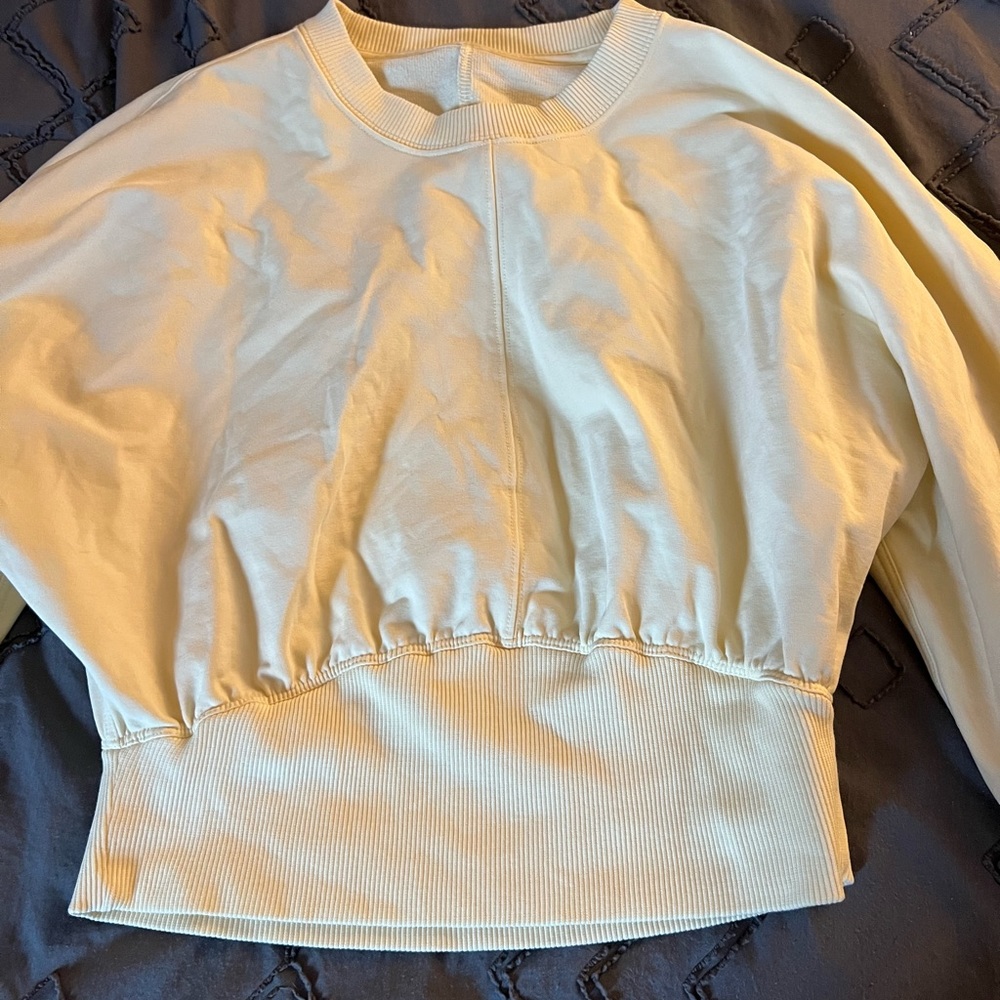 Cropped yellow Lululemon sweatshirt
